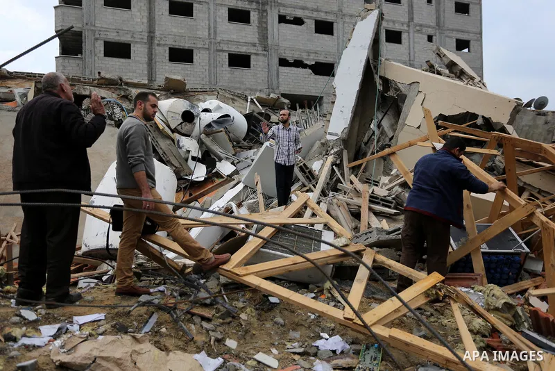 Palestinians inspect the rubble of the television station al-Aqsa TV destroyed by Israeli air strikes in Gaza City on November 15, 2018. Photo by Ashraf Amra