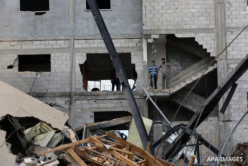 Palestinians inspect the rubble of the television station al-Aqsa TV destroyed by Israeli air strikes in Gaza City on November 15, 2018. Photo by Ashraf Amra