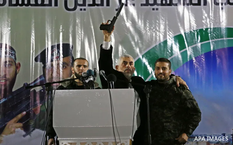 Hamas's leader in the Gaza Strip Yahya Sinwar attends a memorial service for seven members of Ezzedine al-Qassam Brigades, the armed wing of the Palestinian Hamas movement who were killed during an Israeli special forces...