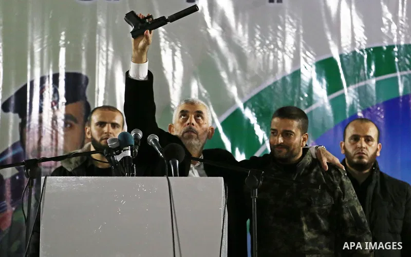 Hamas's leader in the Gaza Strip Yahya Sinwar attends a memorial service for seven members of Ezzedine al-Qassam Brigades, the armed wing of the Palestinian Hamas movement who were killed during an Israeli special forces...