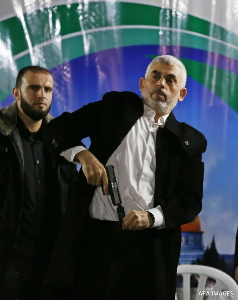Hamas's leader in the Gaza Strip Yahya Sinwar attends a memorial service for seven members of Ezzedine al-Qassam Brigades, the armed wing of the Palestinian Hamas movement who were killed during an Israeli special forces...