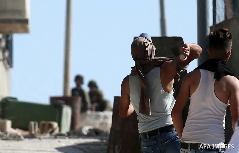 Palestinian protesters clash with Israeli forces after prevent Palestinian farmers to reach to their lands and planting olive trees, in the West Bank village of Urif, near Nablus on November 17, 2018. Photo by Shadi Jara...