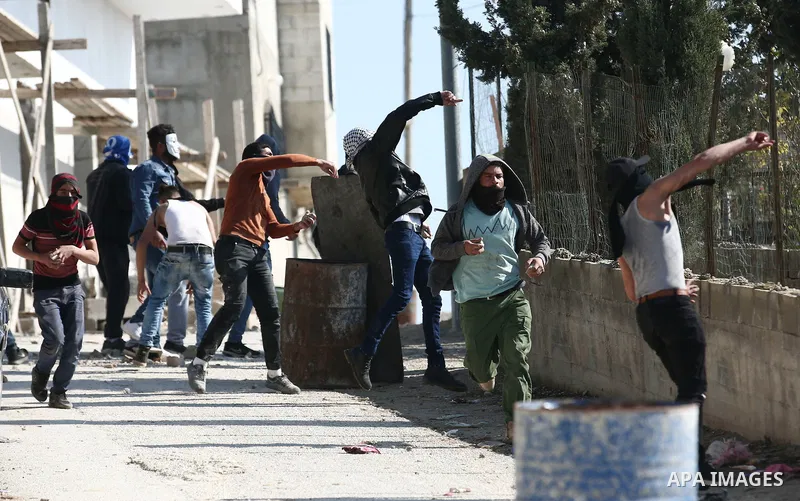 Palestinian protesters clash with Israeli forces after prevent Palestinian farmers to reach to their lands and planting olive trees, in the West Bank village of Urif, near Nablus on November 17, 2018. Photo by Shadi Jara...