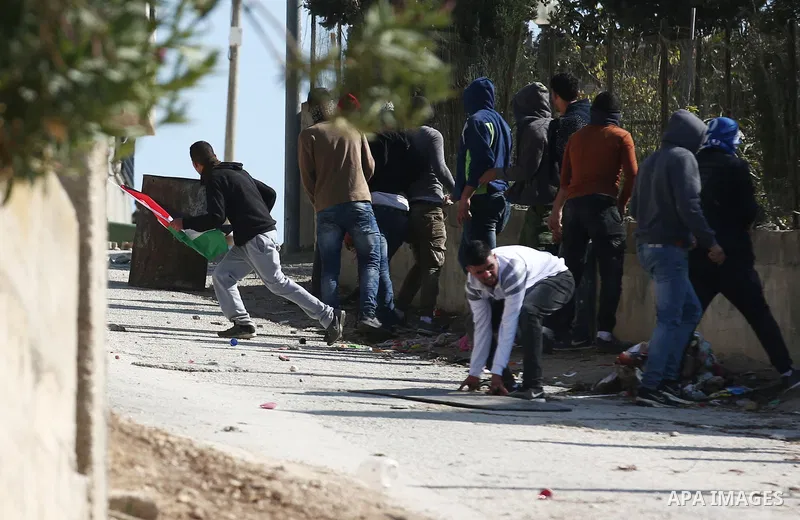 Palestinian protesters clash with Israeli forces after prevent Palestinian farmers to reach to their lands and planting olive trees, in the West Bank village of Urif, near Nablus on November 17, 2018. Photo by Shadi Jara...