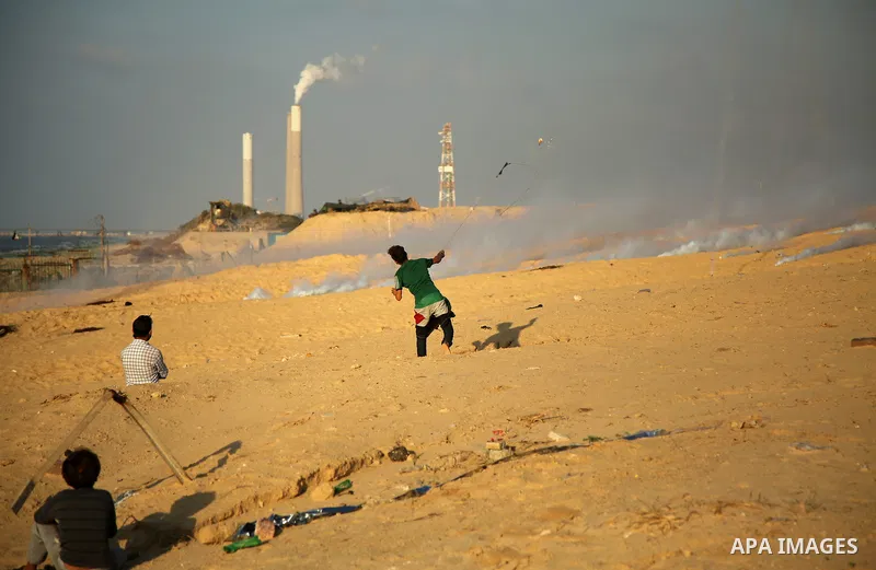 Palestinian protesters gather during clashes with Israeli forces in a demonstration against the Israeli blockade on Gaza Strip, along the Gaza sea barrier on the maritime border with Israel near Kibbutz Zikim, north of B...