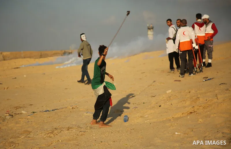 Palestinian protesters gather during clashes with Israeli forces in a demonstration against the Israeli blockade on Gaza Strip, along the Gaza sea barrier on the maritime border with Israel near Kibbutz Zikim, north of B...