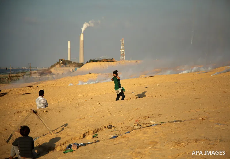 Palestinian protesters gather during clashes with Israeli forces in a demonstration against the Israeli blockade on Gaza Strip, along the Gaza sea barrier on the maritime border with Israel near Kibbutz Zikim, north of B...