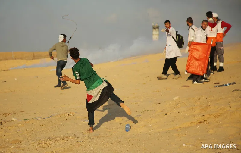 Palestinian protesters gather during clashes with Israeli forces in a demonstration against the Israeli blockade on Gaza Strip, along the Gaza sea barrier on the maritime border with Israel near Kibbutz Zikim, north of B...