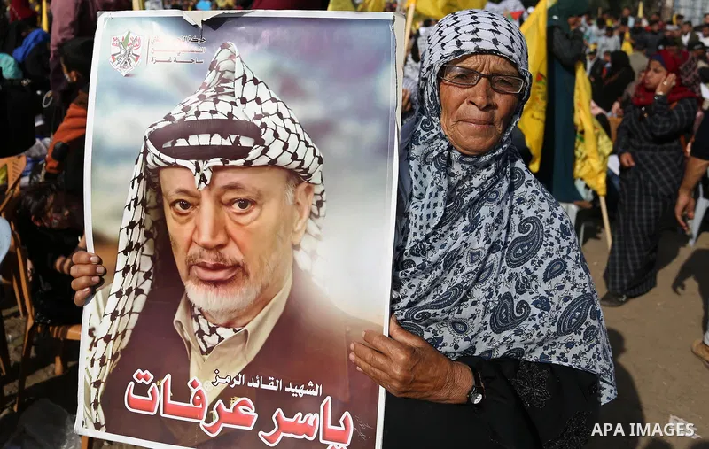 Palestinian Fatah supporters take part in a rally to mark the 14th anniversary of the death of late Palestinian leader Yasser Arafat in Gaza City on November 20, 2018. Photo by Ashraf Amra