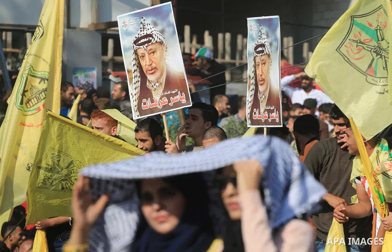 Palestinian Fatah supporters take part in a rally to mark the 14th anniversary of the death of late Palestinian leader Yasser Arafat in Gaza City on November 20, 2018. Photo by Mahmoud Khattab