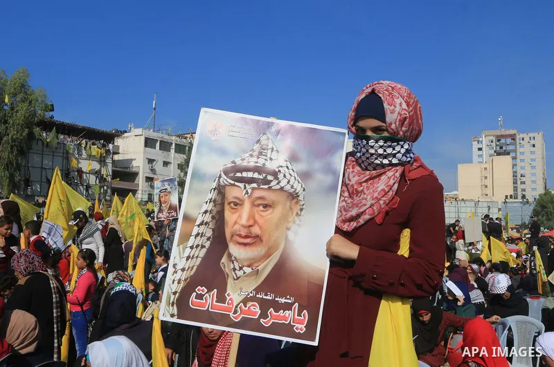 Palestinian Fatah supporters take part in a rally to mark the 14th anniversary of the death of late Palestinian leader Yasser Arafat in Gaza City on November 20, 2018. Photo by Mahmoud Khattab