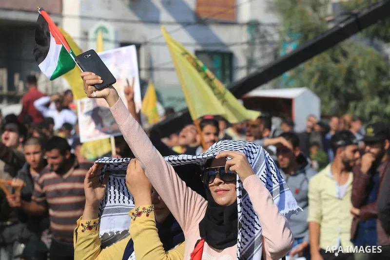 Palestinian Fatah supporters take part in a rally to mark the 14th anniversary of the death of late Palestinian leader Yasser Arafat in Gaza City on November 20, 2018. Photo by Mahmoud Khattab