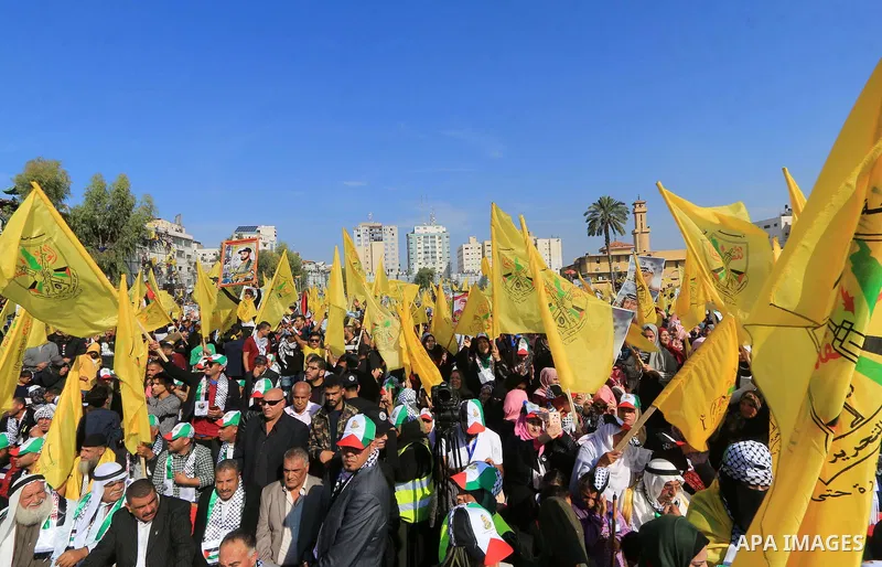 Palestinian Fatah supporters take part in a rally to mark the 14th anniversary of the death of late Palestinian leader Yasser Arafat in Gaza City on November 20, 2018. Photo by Mahmoud Khattab