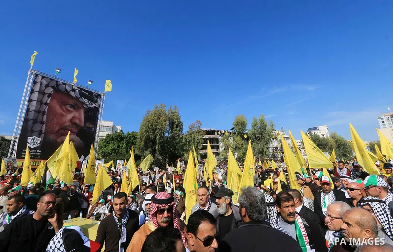Palestinian Fatah supporters take part in a rally to mark the 14th anniversary of the death of late Palestinian leader Yasser Arafat in Gaza City on November 20, 2018. Photo by Mahmoud Khattab