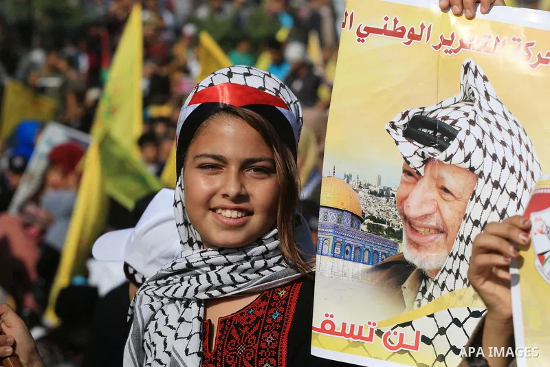 Palestinian Fatah supporters take part in a rally to mark the 14th anniversary of the death of late Palestinian leader Yasser Arafat in Gaza City on November 20, 2018. Photo by Mahmoud Khattab