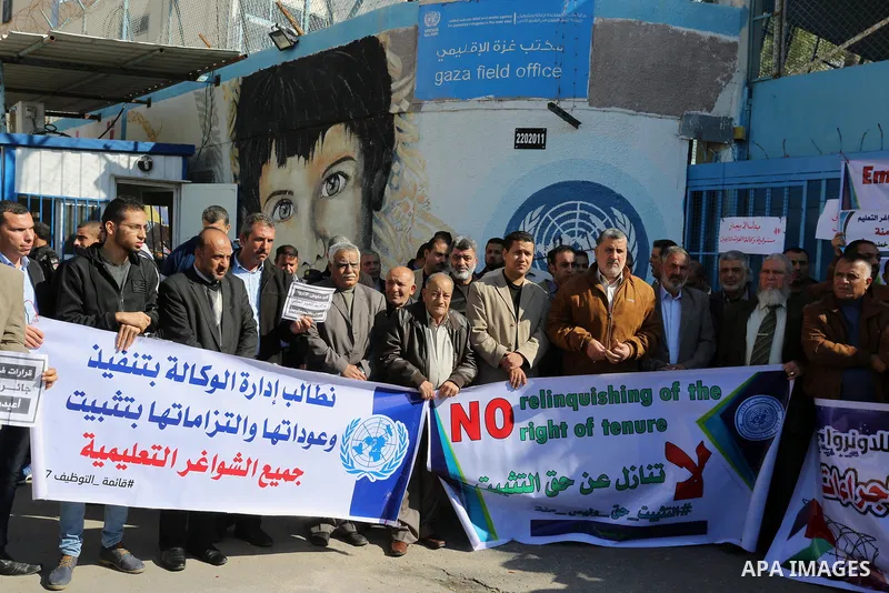 Palestinian employees of United Nations Relief and Works Agency (UNRWA) take part in a protest demanding their rights, outside its headquarter office, in Gaza City on November 25, 2018. Photo by Ashraf Amra