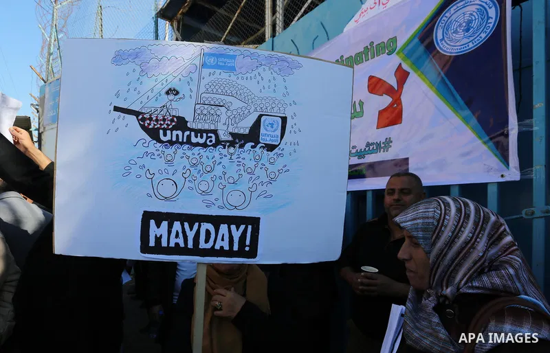 Palestinian employees of United Nations Relief and Works Agency (UNRWA) take part in a protest demanding their rights, outside its headquarter office, in Gaza City on November 25, 2018. Photo by Ashraf Amra
