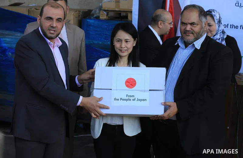 Palestinians attend a press conference for the Japanese ambassador on drugs provided by a grant from his government, in Gaza City on November 25, 2018. Photo by Ashraf Amra