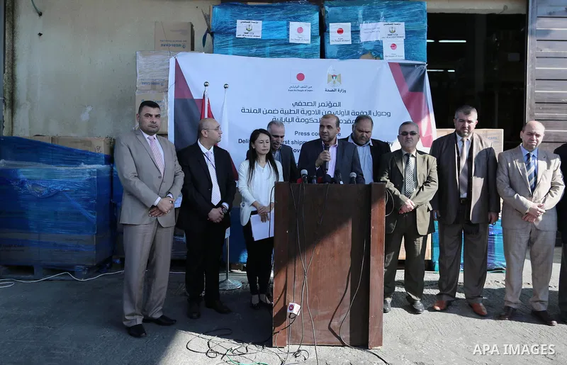 Palestinians attend a press conference for the Japanese ambassador on drugs provided by a grant from his government, in Gaza City on November 25, 2018. Photo by Ashraf Amra