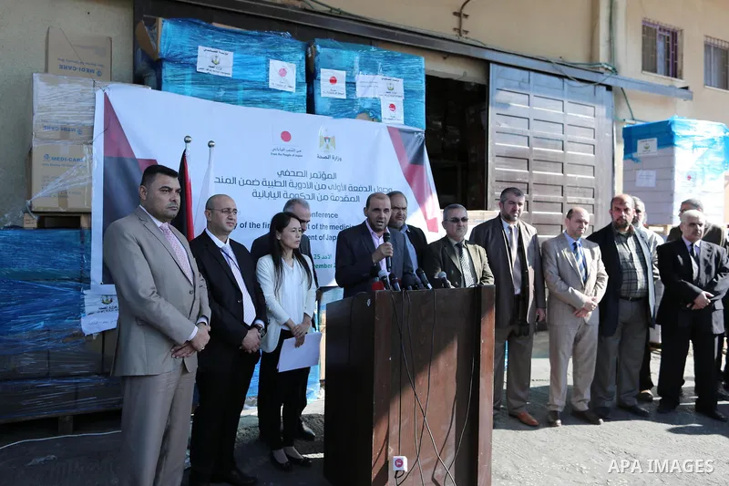 Palestinians attend a press conference for the Japanese ambassador on drugs provided by a grant from his government, in Gaza City on November 25, 2018. Photo by Ashraf Amra