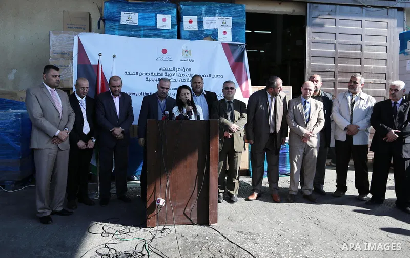 Palestinians attend a press conference for the Japanese ambassador on drugs provided by a grant from his government, in Gaza City on November 25, 2018. Photo by Ashraf Amra