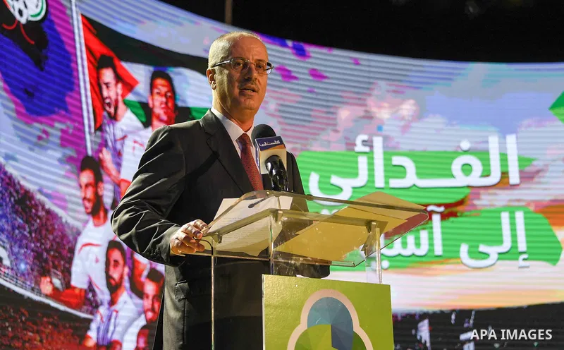 Palestinian Prime Minister, Rami Hamdallah, attends a ceremony honoring the national football team to participate in the Asian Cup, in the West Bank city of Nablus, on November 25, 2018. Photo by Prime Minister Office