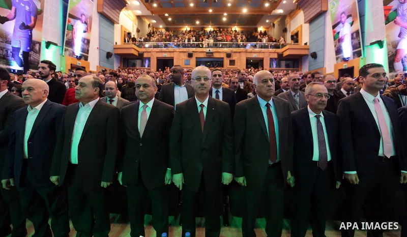 Palestinian Prime Minister, Rami Hamdallah, attends a ceremony honoring the national football team to participate in the Asian Cup, in the West Bank city of Nablus, on November 25, 2018. Photo by Prime Minister Office