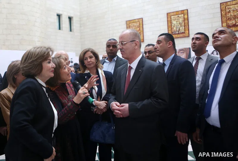 Palestinian Prime Minister Rami Hamdallah attends an exhibition of life of Palestinians who were displaced in 1948 at an-Najah University in the West Bank city of Nablus on November 25, 2018. Photo by Shadi Hatem