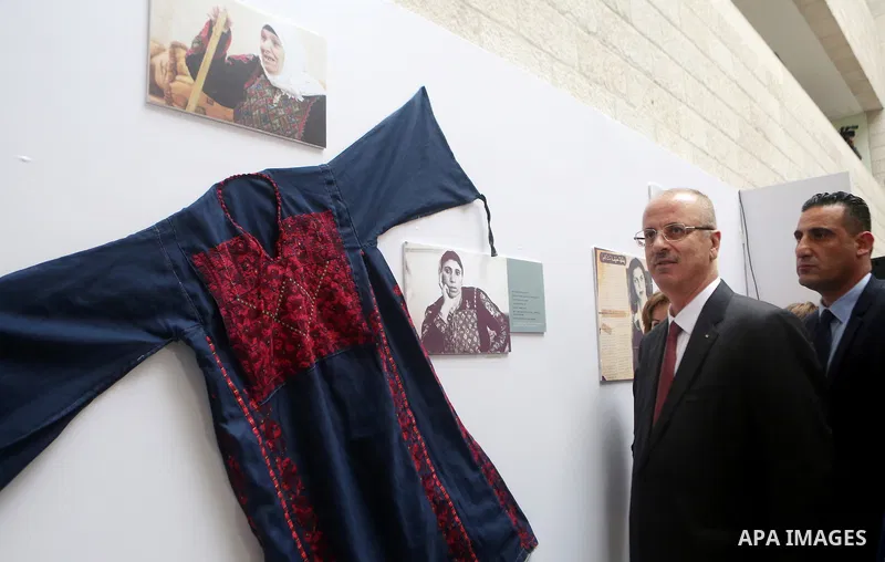 Palestinian Prime Minister Rami Hamdallah attends an exhibition of life of Palestinians who were displaced in 1948 at an-Najah University in the West Bank city of Nablus on November 25, 2018. Photo by Shadi Hatem