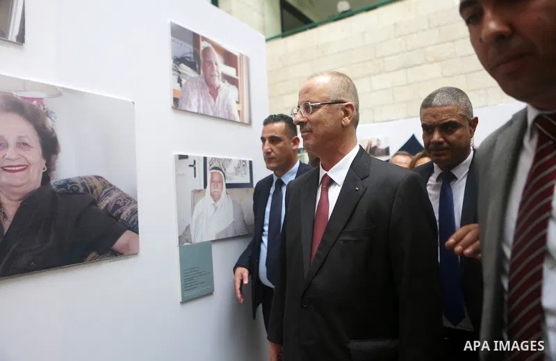Palestinian Prime Minister Rami Hamdallah attends an exhibition of life of Palestinians who were displaced in 1948 at an-Najah University in the West Bank city of Nablus on November 25, 2018. Photo by Shadi Hatem