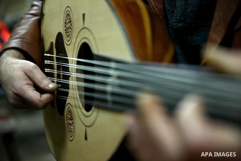Palestinian nurse, Ali Hassanin, 57, who makes lutes, known in Arabic as an "Oud", works on a musical instrument, at his workshop, in the West Bank city of Nablus on November 26, 2018. Photo by Shadi Jarar'ah