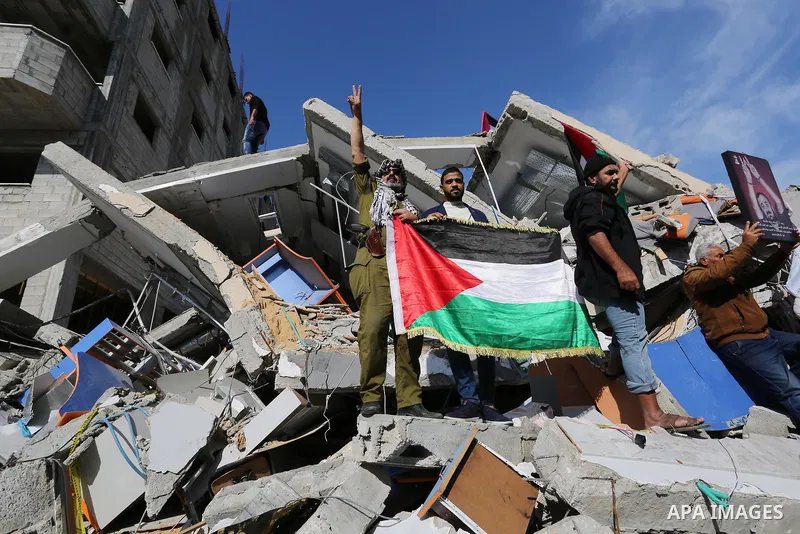 Palestinians take part during a protest against targeting of the television station al-Aqsa TV which was destroyed by Israeli air strikes in Gaza City on November 26, 2018. Photo by Ashraf Amra