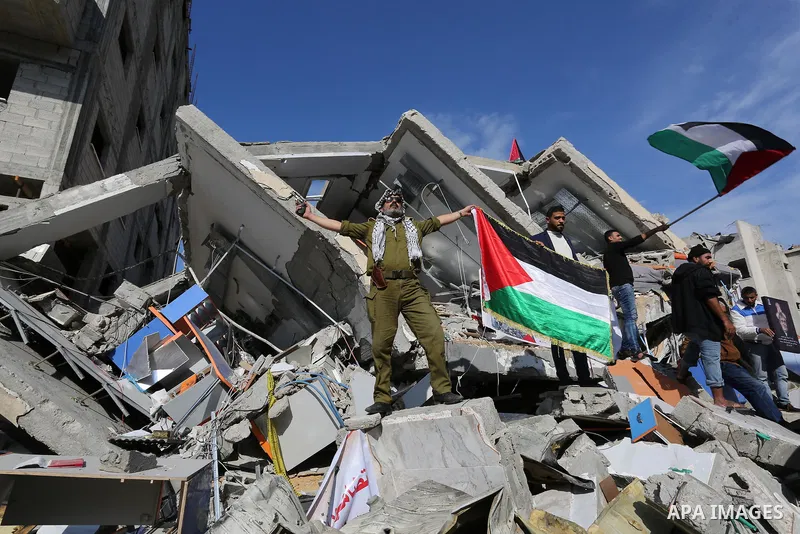 Palestinians take part during a protest against targeting of the television station al-Aqsa TV which was destroyed by Israeli air strikes in Gaza City on November 26, 2018. Photo by Ashraf Amra