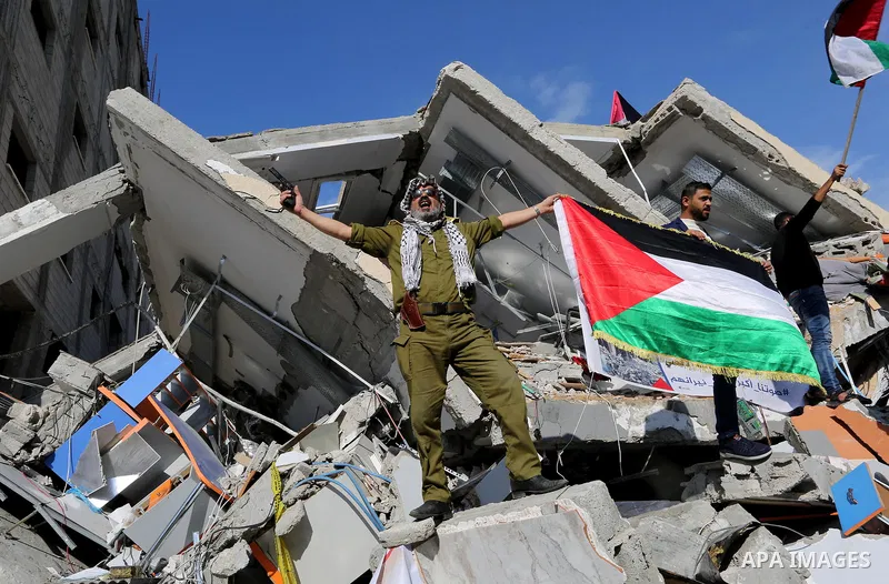 Palestinians take part during a protest against targeting of the television station al-Aqsa TV which was destroyed by Israeli air strikes in Gaza City on November 26, 2018. Photo by Ashraf Amra