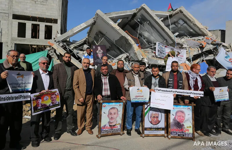 Palestinians take part during a protest against targeting of the television station al-Aqsa TV which was destroyed by Israeli air strikes in Gaza City on November 26, 2018. Photo by Ashraf Amra