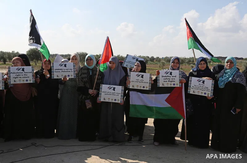 Palestinian women take part during a protest against violence towards women at the Israel-Gaza border, in east of Gaza City on November 26, 2018. Photo by Ashraf Amra