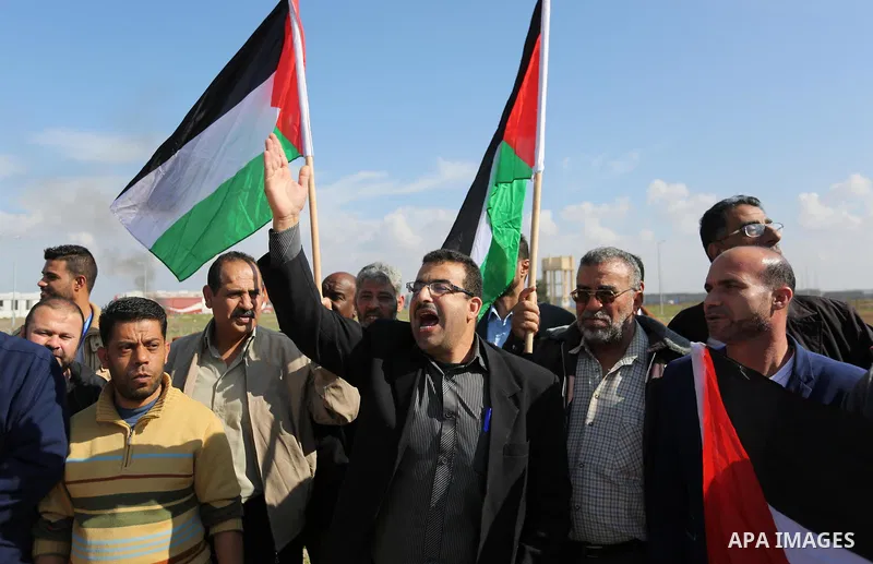 Palestinian women take part during a protest against violence towards women at the Israel-Gaza border, in east of Gaza City on November 26, 2018. Photo by Ashraf Amra