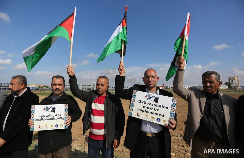 Palestinian women take part during a protest against violence towards women at the Israel-Gaza border, in east of Gaza City on November 26, 2018. Photo by Ashraf Amra