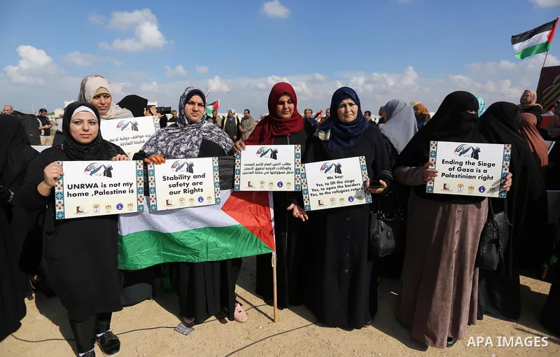 Palestinian women take part during a protest against violence towards women at the Israel-Gaza border, in east of Gaza City on November 26, 2018. Photo by Ashraf Amra