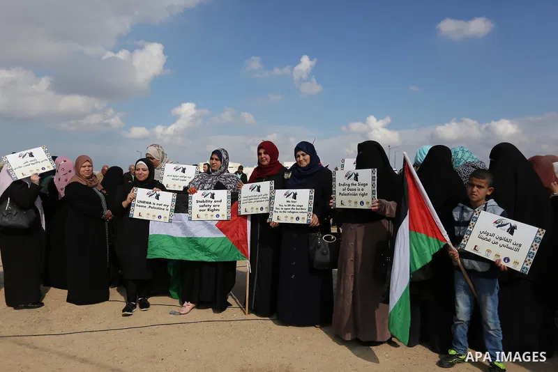 Palestinian women take part during a protest against violence towards women at the Israel-Gaza border, in east of Gaza City on November 26, 2018. Photo by Ashraf Amra