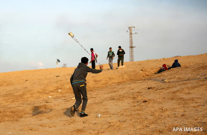 Palestinian protesters gather during clashes with Israeli forces in a demonstration against the Israeli blockade on Gaza Strip, along the Gaza sea barrier on the maritime border with Israel near Kibbutz Zikim, north of B...