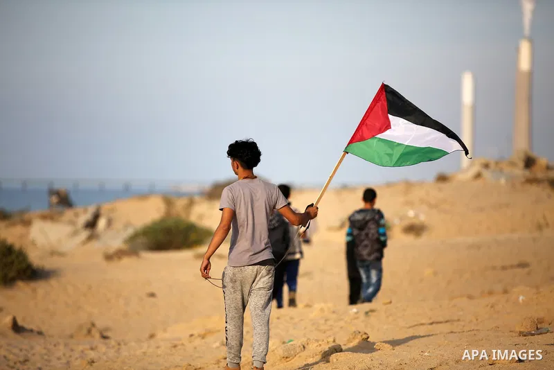 Palestinian protesters gather during clashes with Israeli forces in a demonstration against the Israeli blockade on Gaza Strip, along the Gaza sea barrier on the maritime border with Israel near Kibbutz Zikim, north of B...