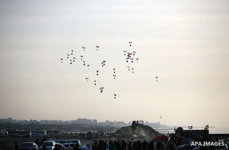 Palestinian protesters gather during clashes with Israeli forces in a demonstration against the Israeli blockade on Gaza Strip, along the Gaza sea barrier on the maritime border with Israel near Kibbutz Zikim, north of B...