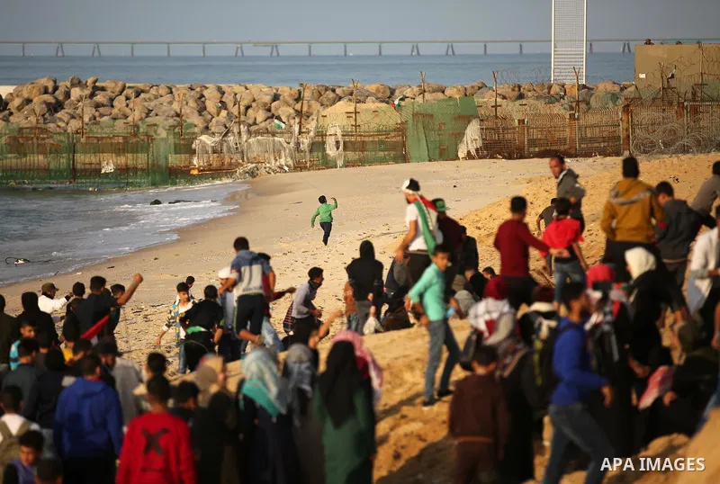 Palestinian protesters gather during clashes with Israeli forces in a demonstration against the Israeli blockade on Gaza Strip, along the Gaza sea barrier on the maritime border with Israel near Kibbutz Zikim, north of B...