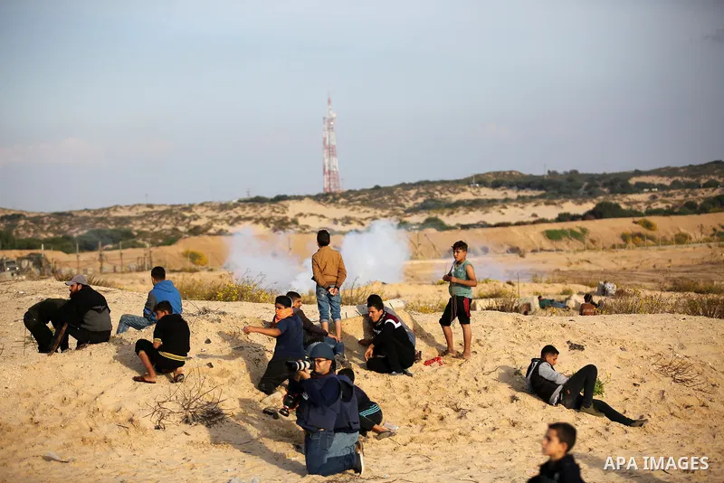 Palestinian protesters gather during clashes with Israeli forces in a demonstration against the Israeli blockade on Gaza Strip, along the Gaza sea barrier on the maritime border with Israel near Kibbutz Zikim, north of B...