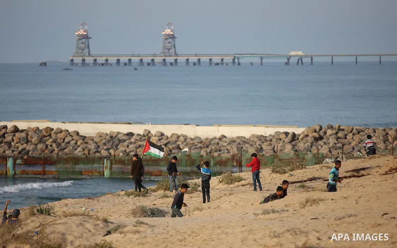 Palestinian protesters gather during clashes with Israeli forces in a demonstration against the Israeli blockade on Gaza Strip, along the Gaza sea barrier on the maritime border with Israel near Kibbutz Zikim, north of B...