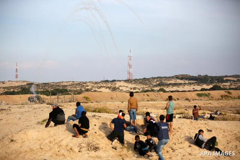 Palestinian protesters gather during clashes with Israeli forces in a demonstration against the Israeli blockade on Gaza Strip, along the Gaza sea barrier on the maritime border with Israel near Kibbutz Zikim, north of B...