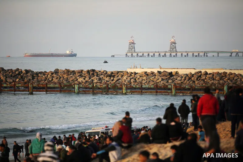 Palestinian protesters gather during clashes with Israeli forces in a demonstration against the Israeli blockade on Gaza Strip, along the Gaza sea barrier on the maritime border with Israel near Kibbutz Zikim, north of B...
