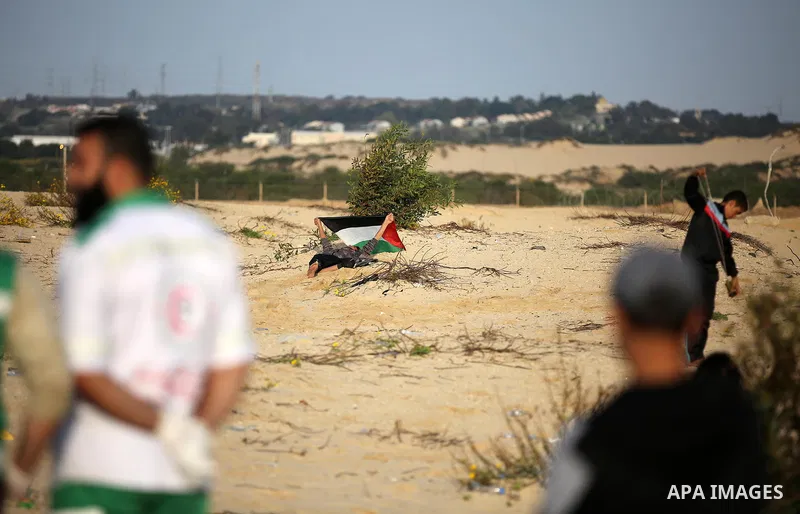 Palestinian protesters gather during clashes with Israeli forces in a demonstration against the Israeli blockade on Gaza Strip, along the Gaza sea barrier on the maritime border with Israel near Kibbutz Zikim, north of B...