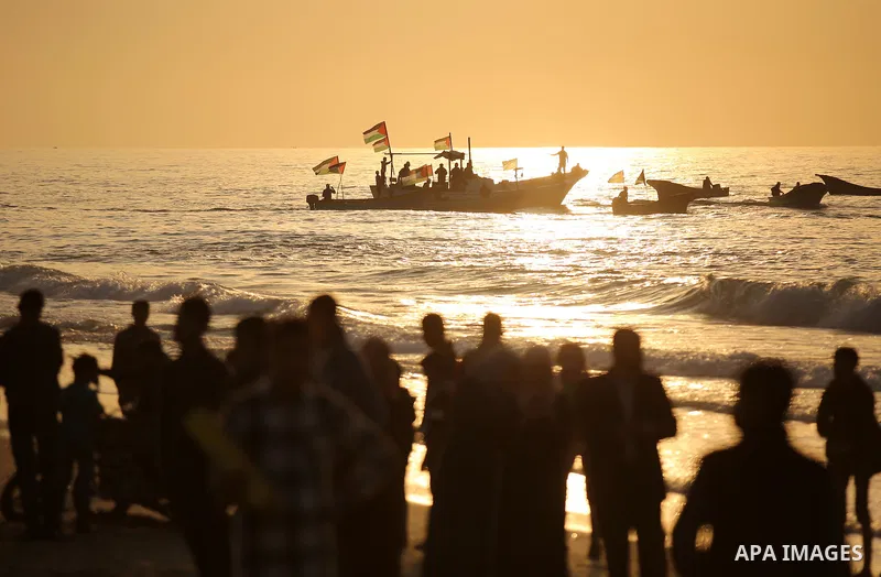 Palestinian protesters sail with boats during a demonstration against the Israeli blockade on Gaza Strip, along the Gaza sea barrier on the maritime border with Israel near Kibbutz Zikim, north of Beit Lahia in the north...